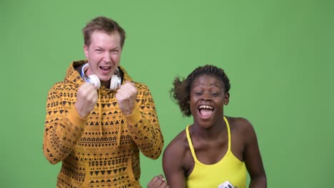 young multi-ethnic couple playing games together