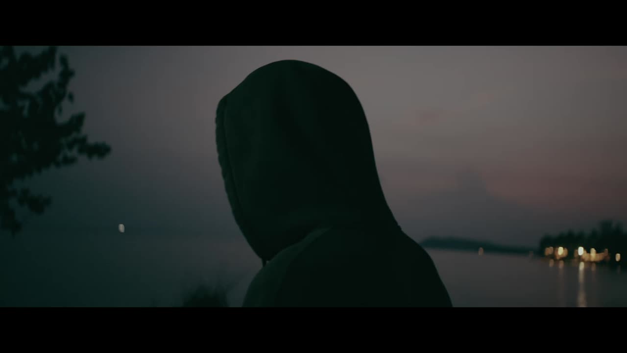 Person in a Hoodie at Dusk