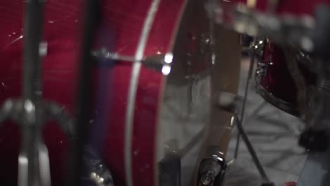 a woman playing on drum in the theatre static shot, close up shot, insert shot