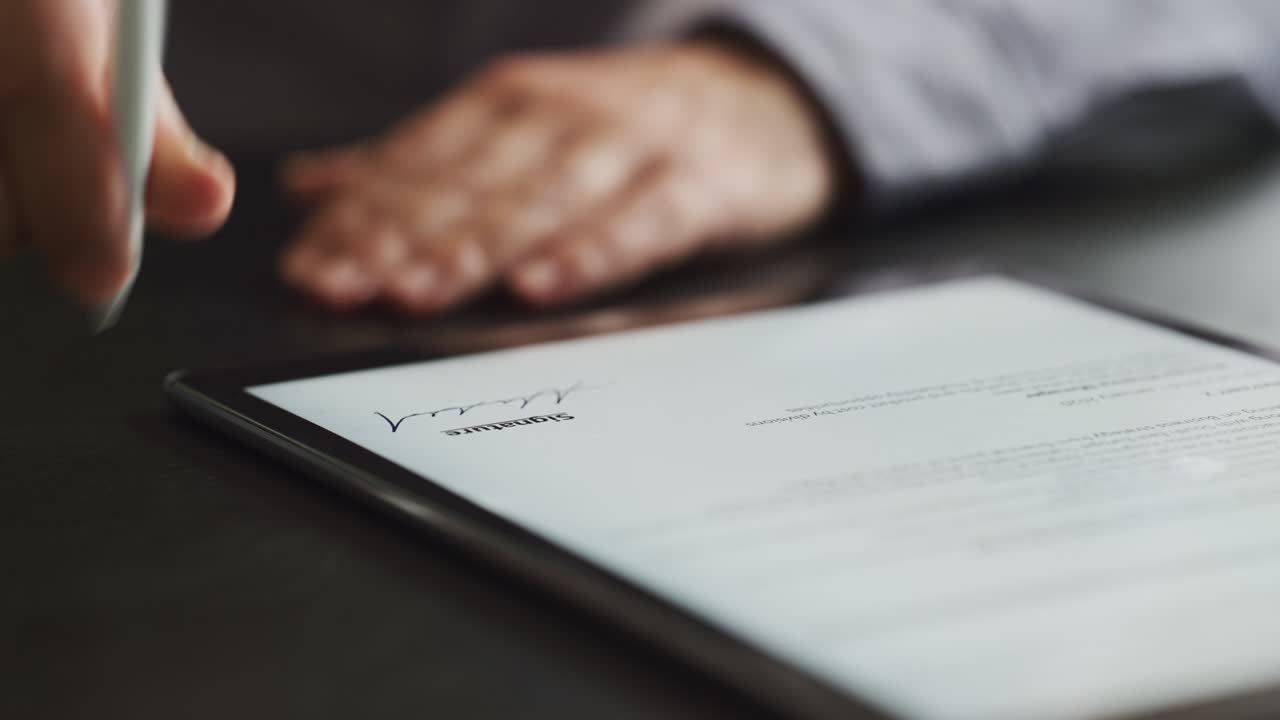 Man Signing The Digital Contract