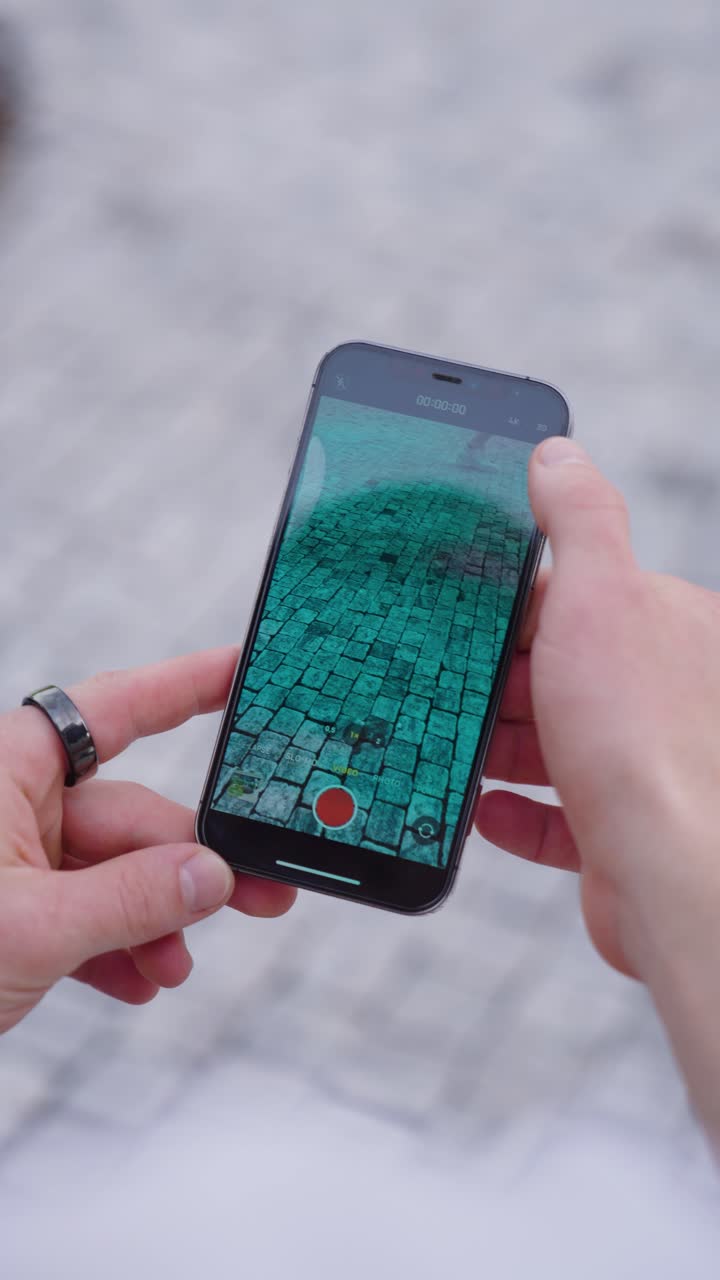 Vertical POV shot of phone in hands and use camera application interface