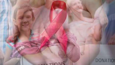 Animation-of-diverse-group-of-volunteers-over-cancer-ribbon