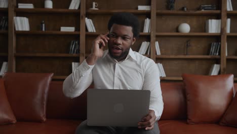 young adult sales man on a job call in his office