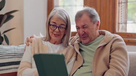 Tablet,-social-media-and-a-senior-couple-laughing