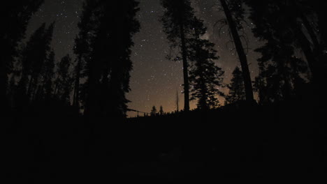 motion night time lapse of the milky way and stars above a campfire at sardine lake campground in sierra buttes california