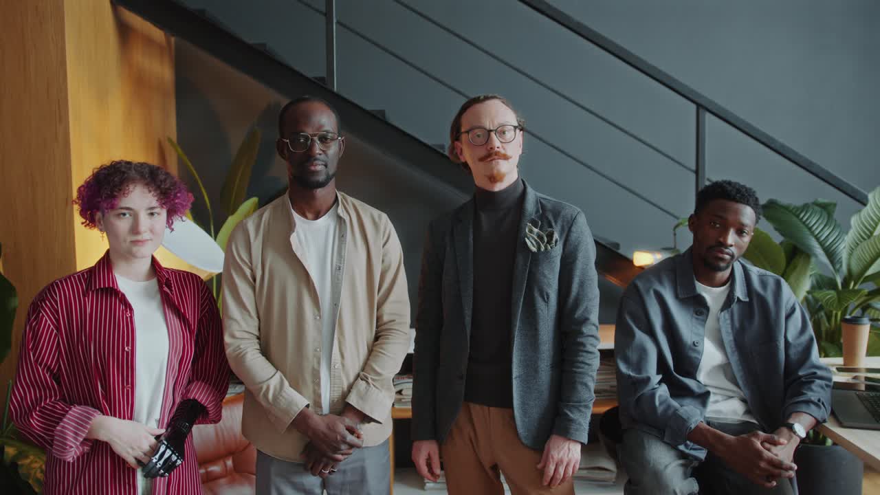 Diverse Group of Business People Posing Together in Stylish Office