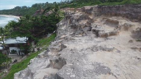 follow along brazilian beachside cliffs overlooking beautiful atlantic ocean