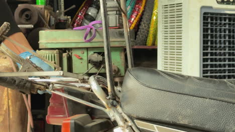 close-up clip of welding work at phung motorbike sister-bar in hà nội, vietnam
