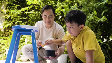 asian man and boy in the backyard