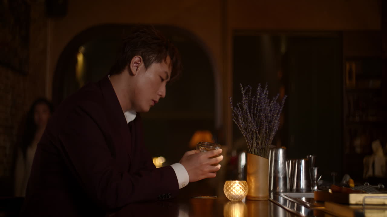 Man Enjoying a Drink at a Nightclub