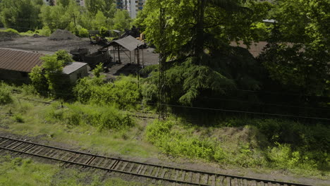 old out-of-use railroad track in abandoned chiatura mining warehouse