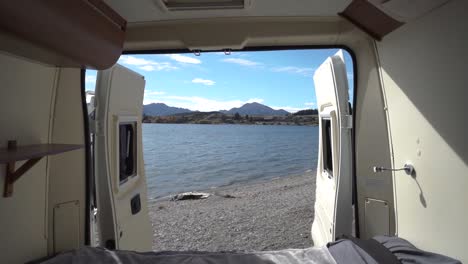 view at lake wanak, new zealand from back of a campervan