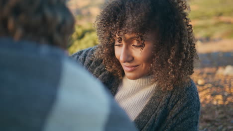 curly girl lying grass nature closeup. tanned woman talking unknown boyfriend