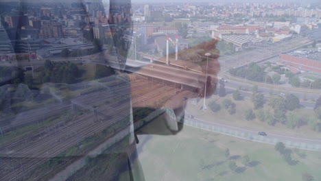 adjusting tie, businessman overlooking cityscape with roads and buildings in animation