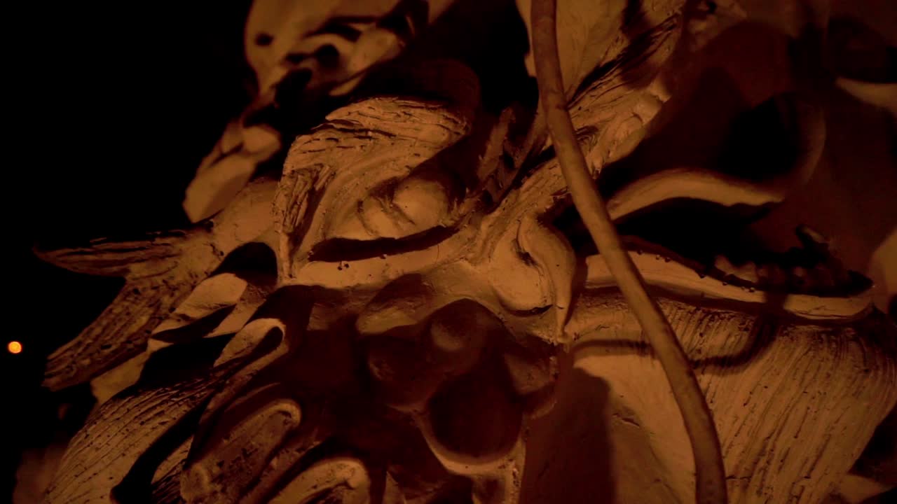 close up shot of a dragon carving in a pillar of a temple in central java indonesia