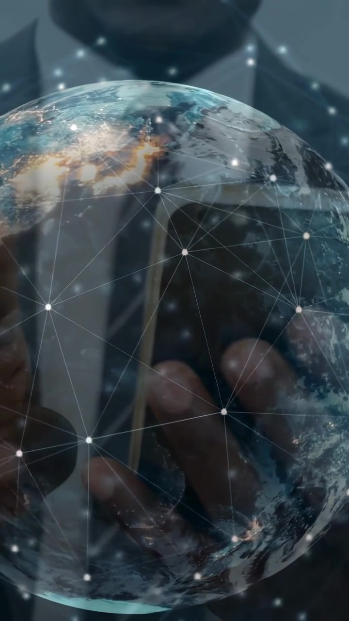 Vertical video: Man in suit moving phone and tapping, showing network globe for business tech