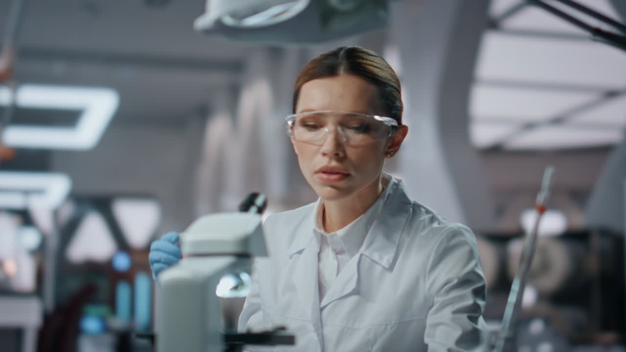 Happy scientist feeling success working in medical laboratory close up.