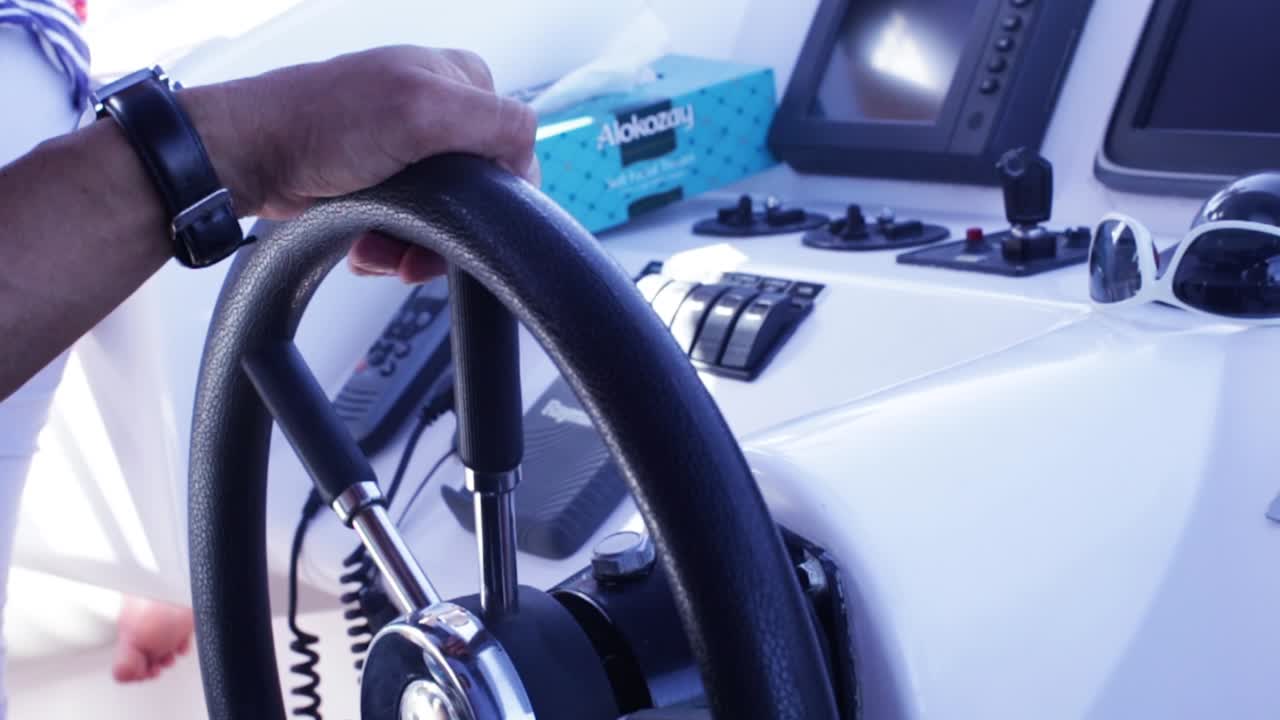 Boat Captain at the Helm