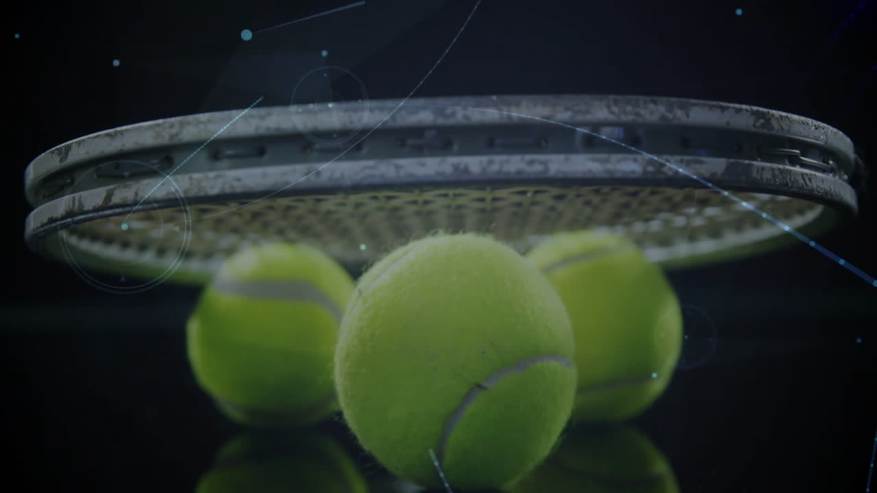 Tennis ball cluster being highlighted on glossy surface, featuring metal racket and HUD graphics