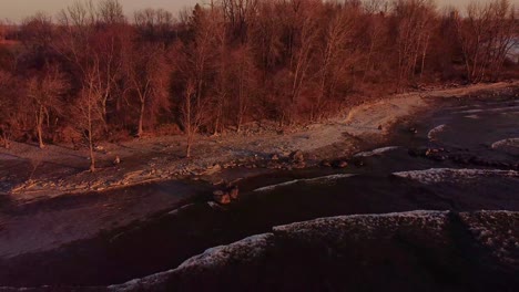 aerial-flying-towards-a-sunrise-on-a-lake