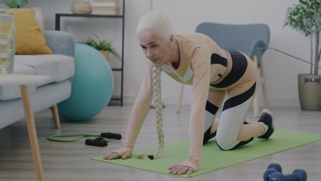 senior woman doing exercises at home