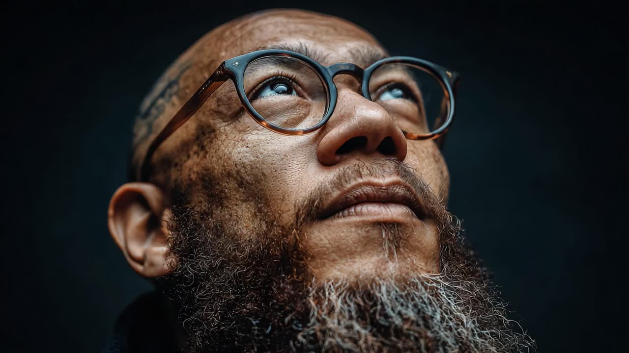 A Profound Portrait of Contemplation: An Introspective Gaze and Raw Emotions Captured in Two Striking Frames, Showcasing Depth and Character in a Unique Lighting Setting