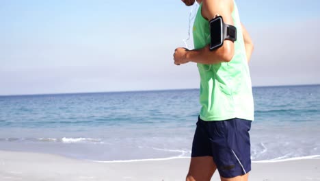 Fit-man-jogging-on-the-beach