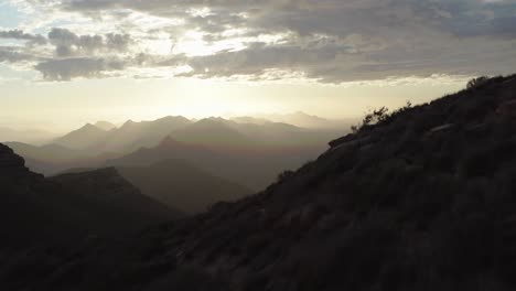 4k aerial reveal shot of rolling hills in the leeuwenboschfontein mountain range western cape, south africa