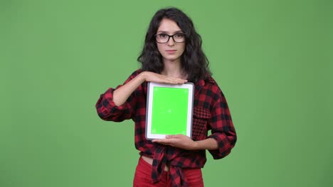 young beautiful businesswoman showing digital tablet