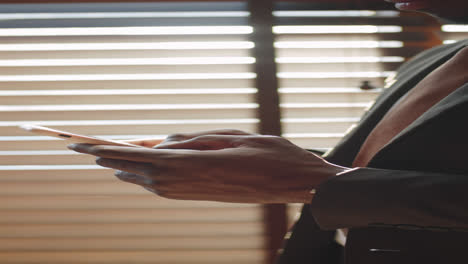 afro-american businessman messaging on smartphone