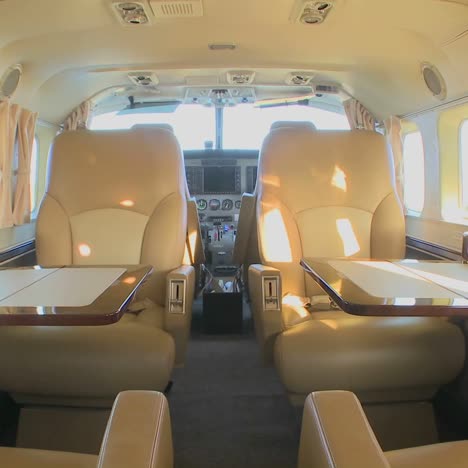 dolly forward through the interior of a corporate luxury jet