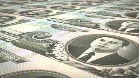 billetes de mil won de corea del norte rodando, dinero en efectivo, bucle