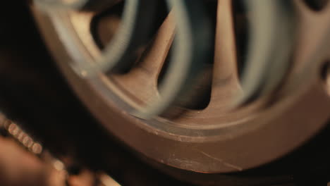 close-up of a machine pulley and belt