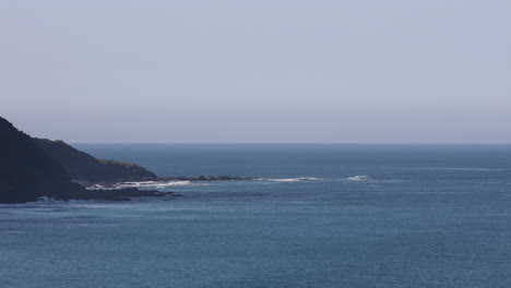 static view capturing waves of the sea keep crashing against the rock continuously