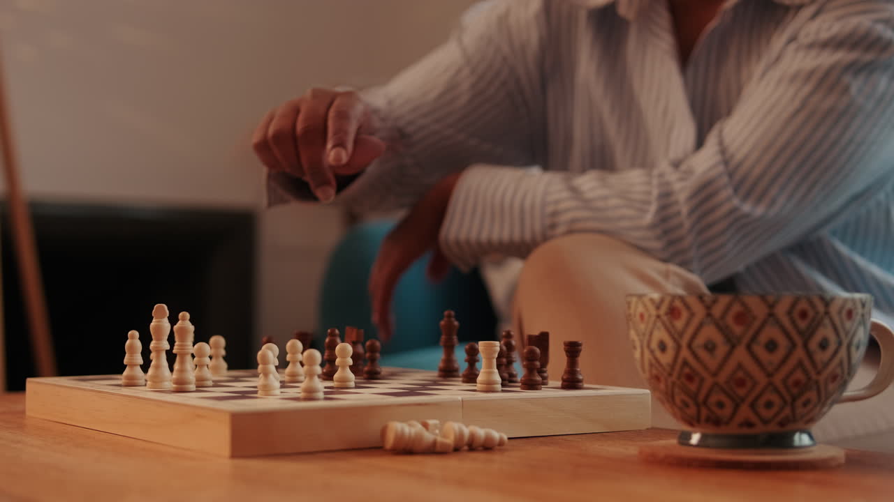 Woman Playing Chess and Drinking Tea