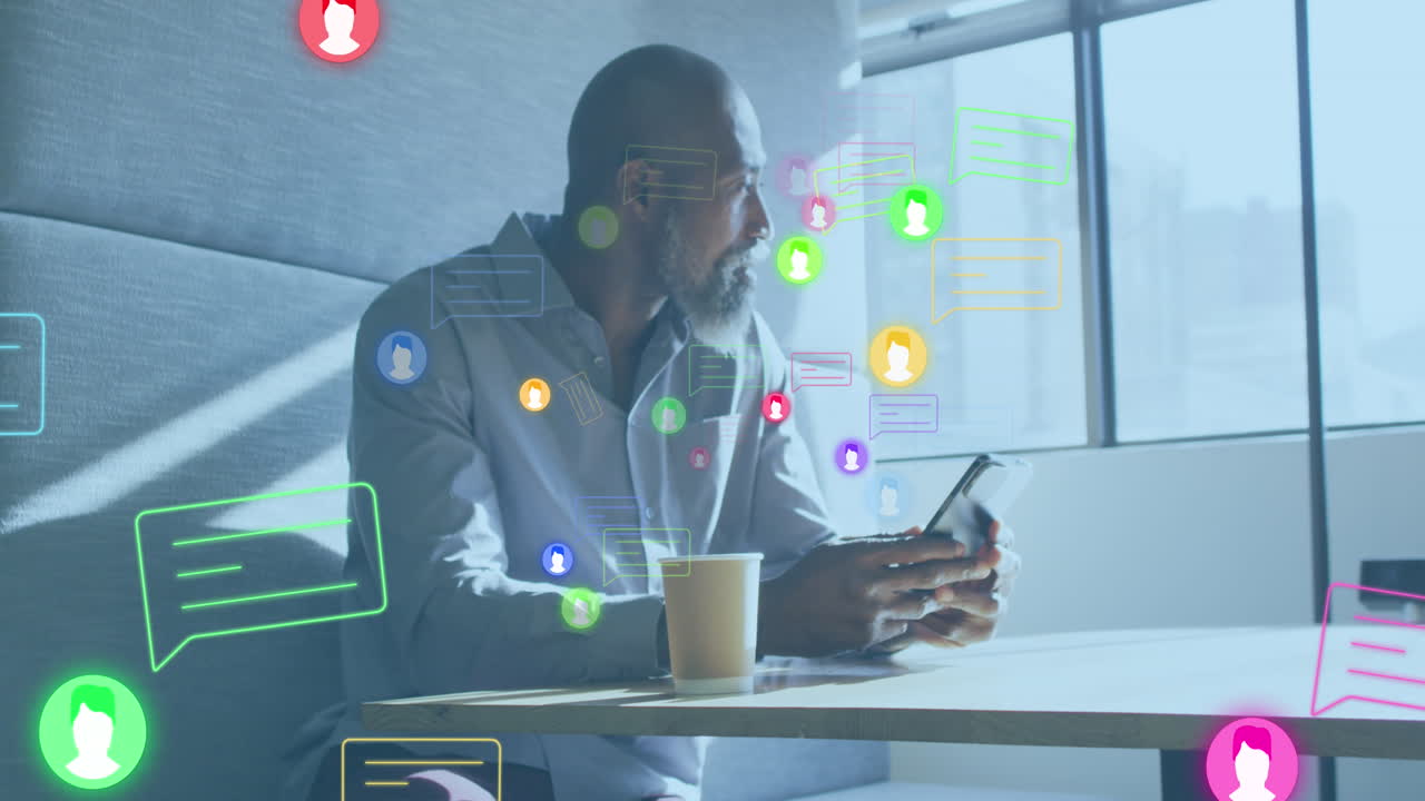 Animation of media icons over african american businessman working in office