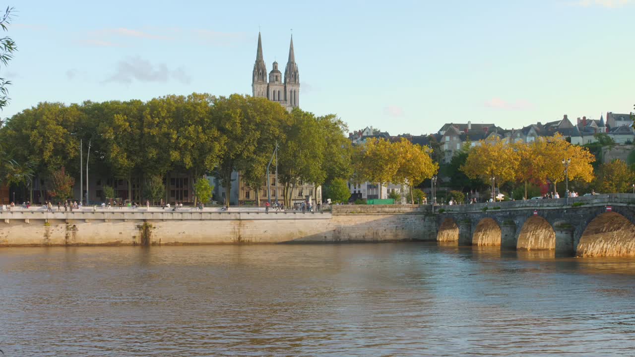Verdun Bridge (Pont de Verdun) Over Maine River With Angers Cathedral Towers In The Background In France. - wide shot