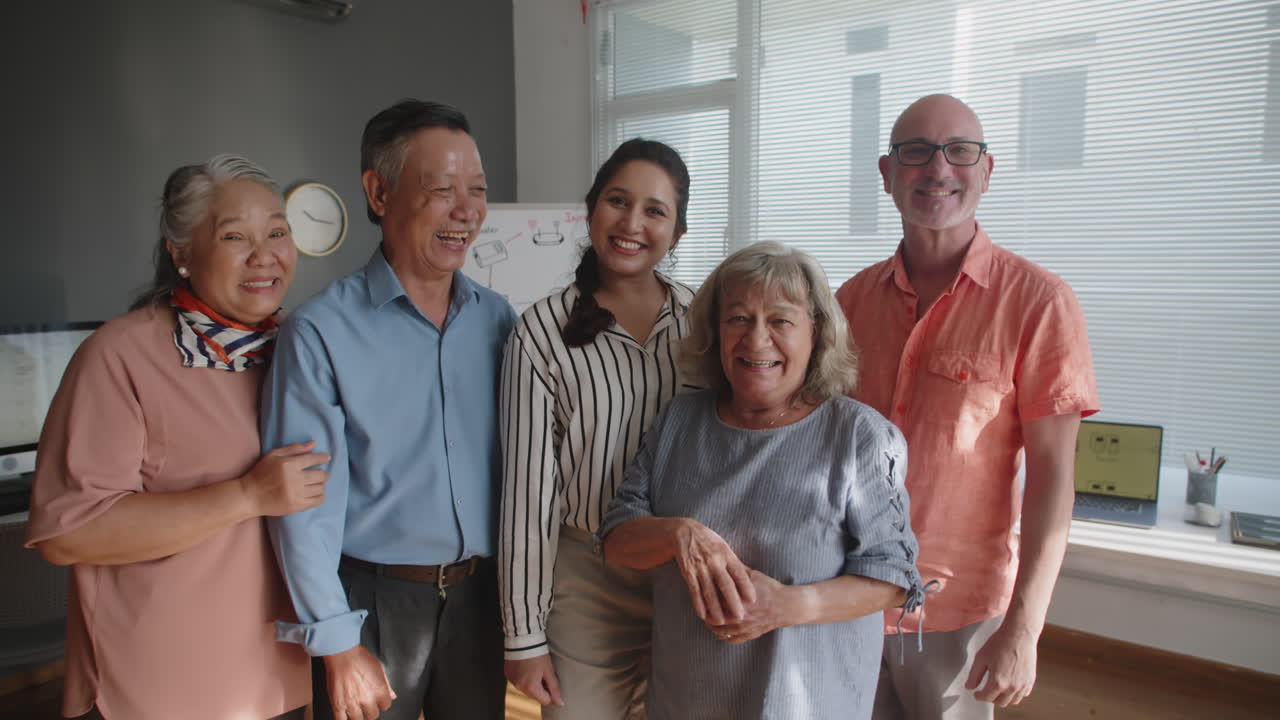 Group Portrait of Seniors and Young Teacher after Computer Class