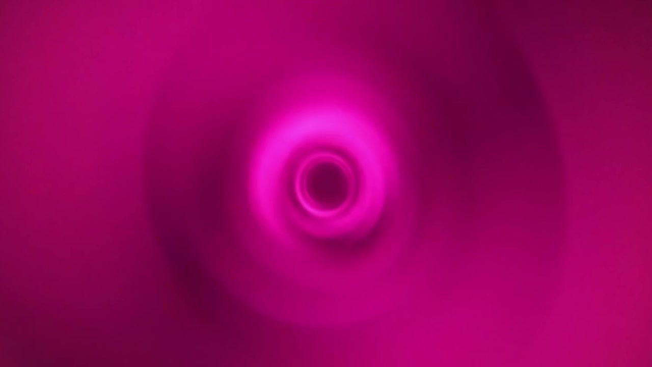 Boucle d'arrière-plan : tunnel vortex rose abstrait tourbillonnant