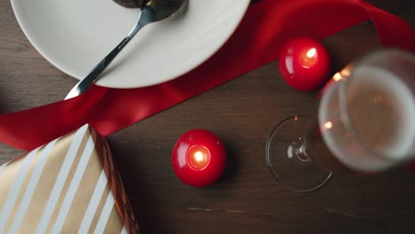 cosy dinner date setting with delicious desert and a glass of champagne