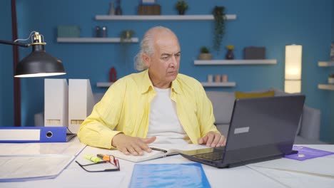 Home-office-worker-old-man-working-with-concentration.