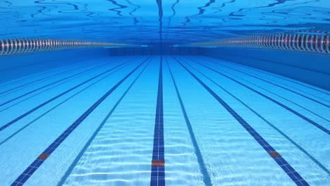 olympic swimming pool under water background.