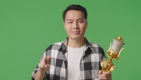 happy man with trophy