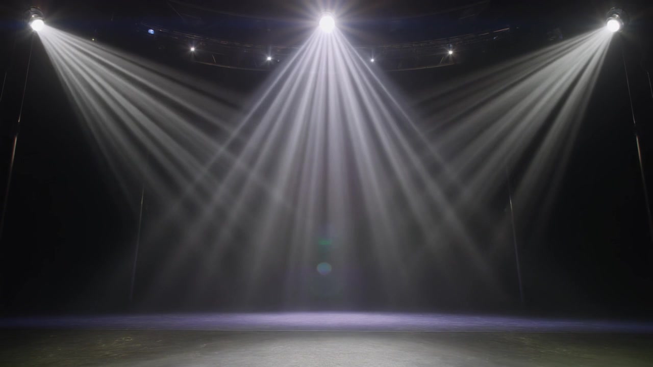 Empty Stage With Bright White Spotlights and Haze