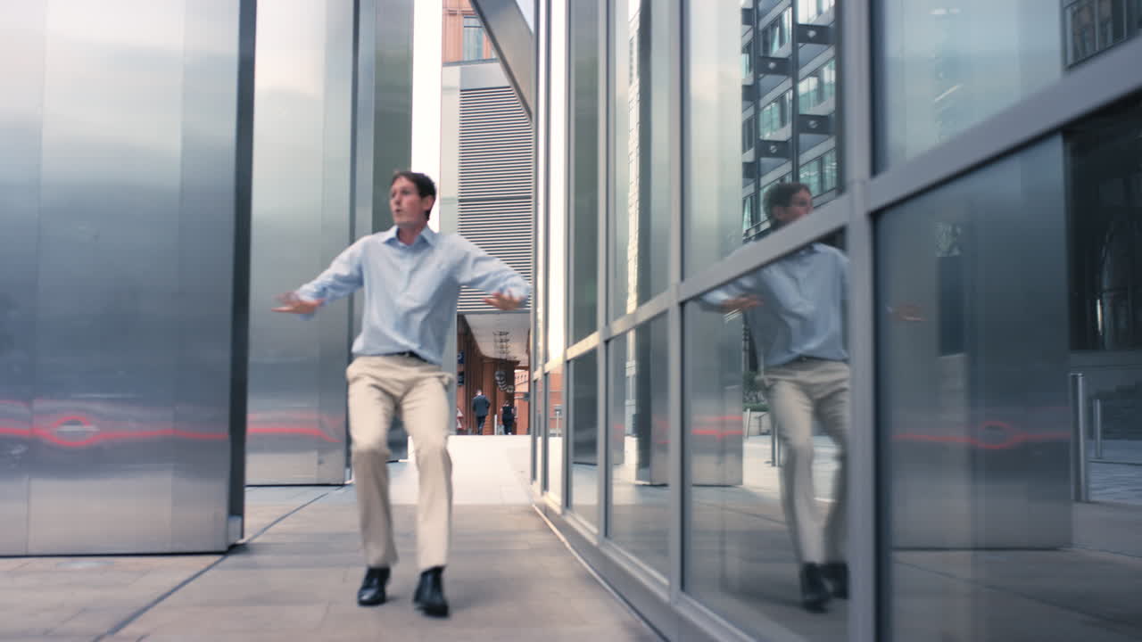 Contemporary funky caucasian businessman street dancer dancing freestyle in the city