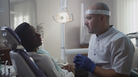 dentist discussing treatment with patient