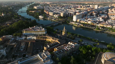 teatro de la maestranza near the torre del oro in the early morning in seville, spain