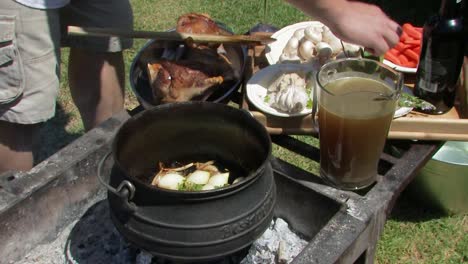 Adding-vegetables-to-the-pootjie-pot