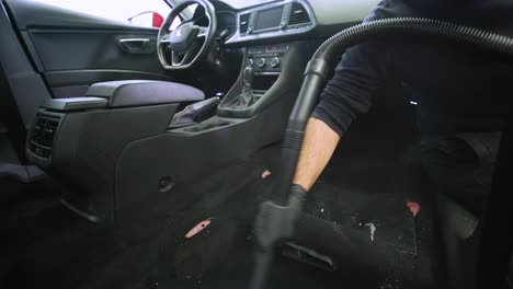 professional car cleaning. сar wash. interior detailing. dry clean and detail a car interior. deep seats cleaning. wiping foam in car wash. cleaning the car panel from dust. a vacuum cleaner