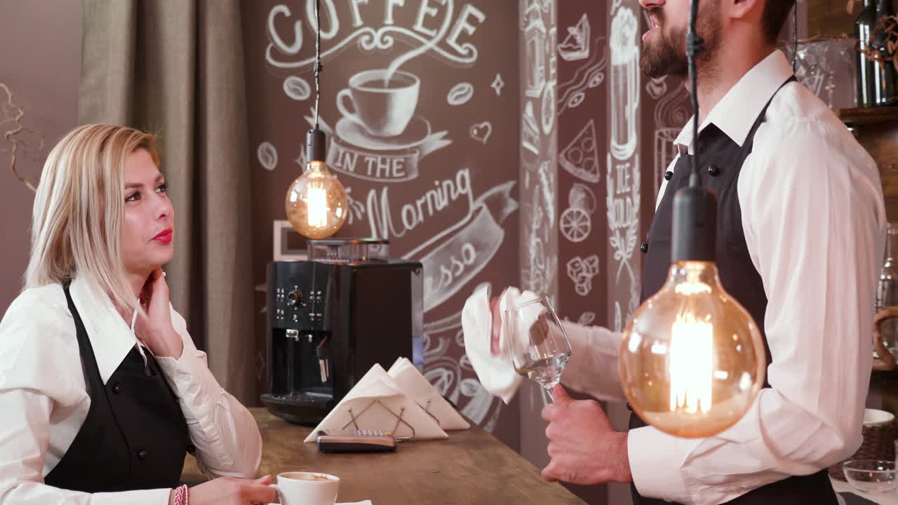 Barista Serving Coffee to a Customer at a Cafe
